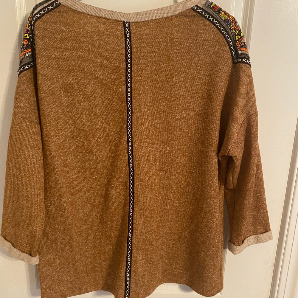 Dark tan sweater with beaded shoulders